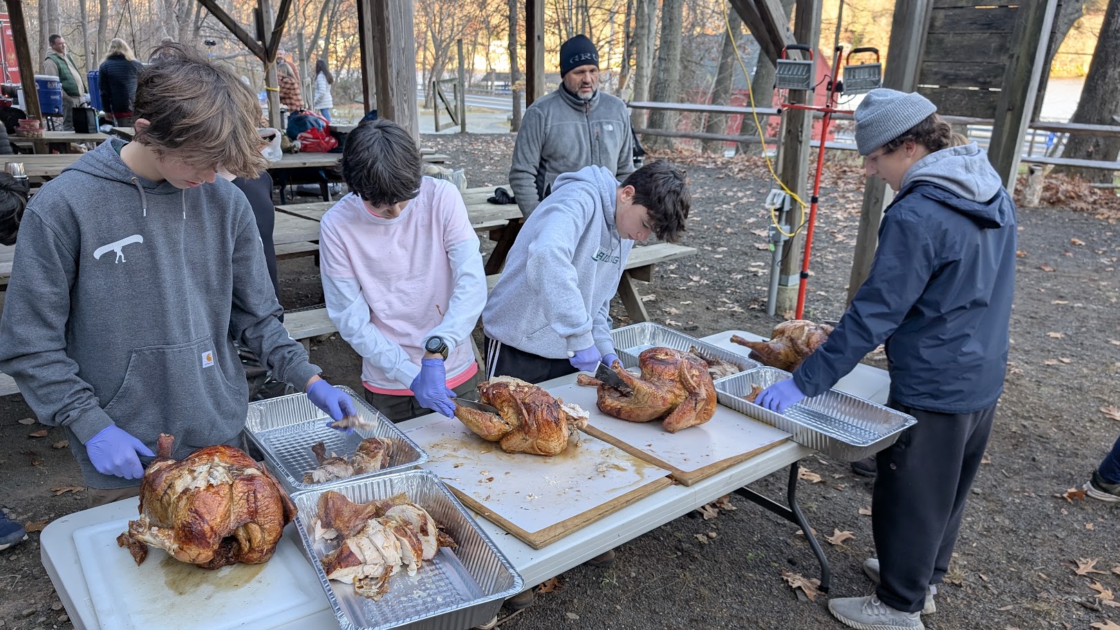 Volunteers carving birds at Webelos Only Training Weekend Activities (W.O.T.W.A.).